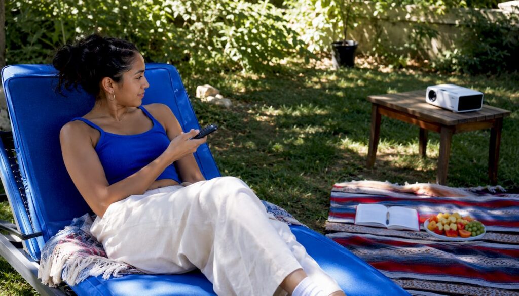Young woman watching Spanish animated movie at home