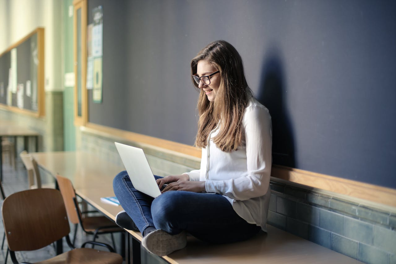 A woman studying from her laptop 