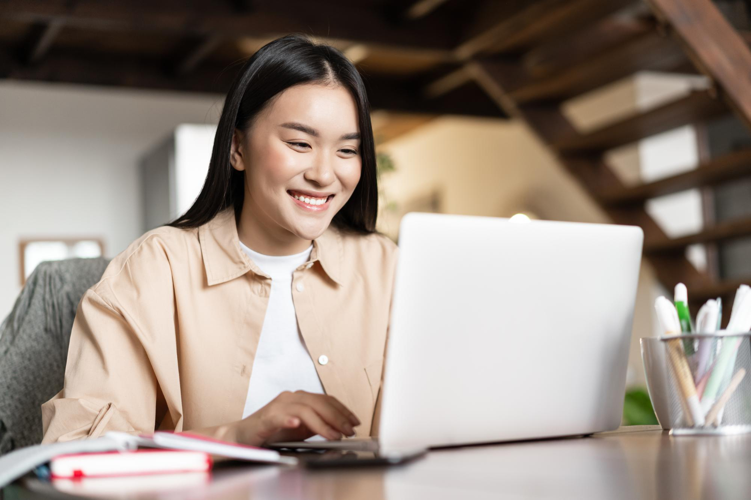 Woman smiling in her laptop