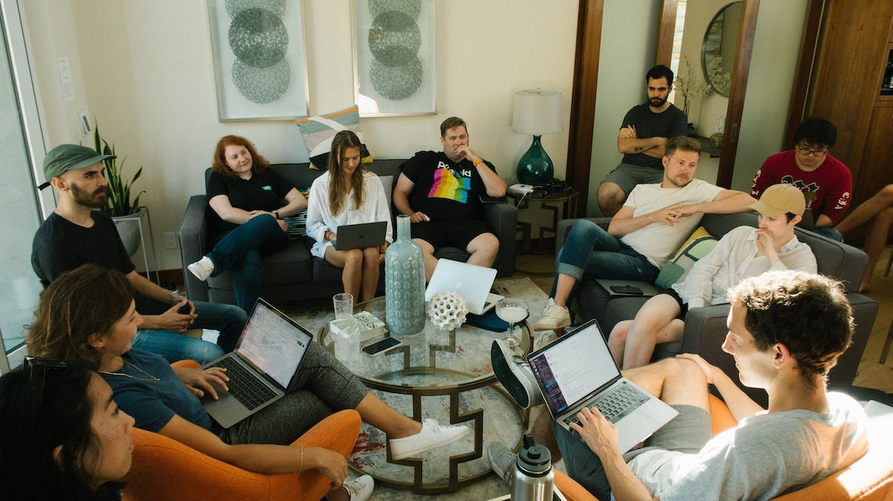 a set of people discussing and group sharing