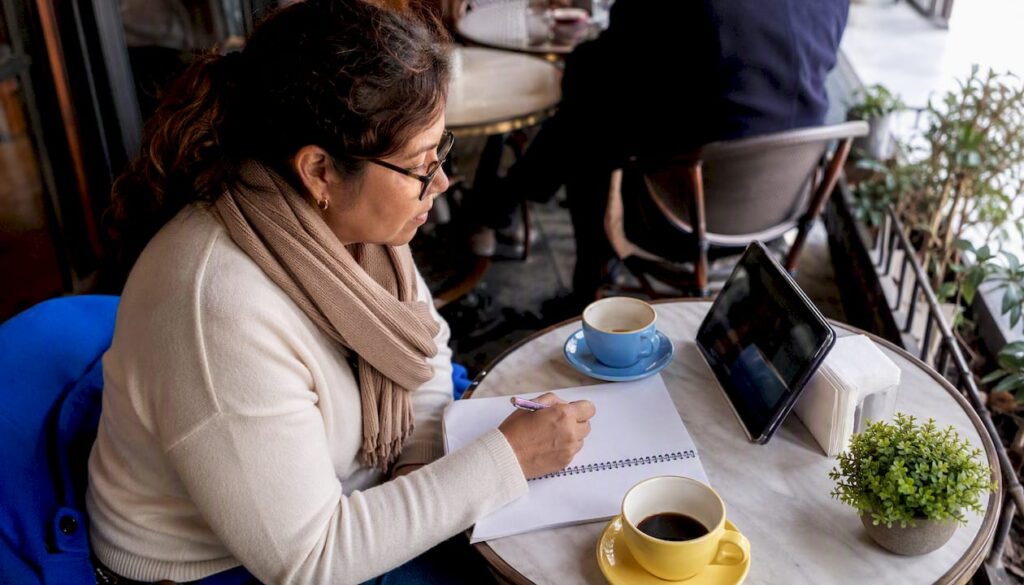 Adult woman studying Spanish lesson at home