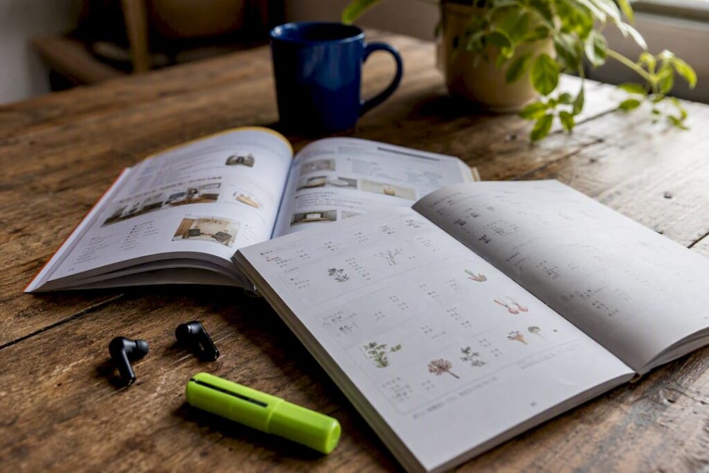 Open Spanish and Mandarin language books on desk